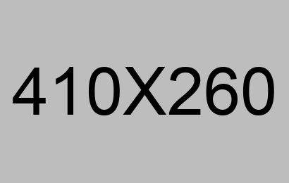 Code on a monitor beside glasses